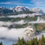 Hohenwerfen Castle in Austria. Foggy morning in Autumnal Season