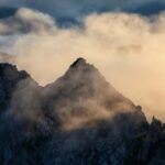 sunlight in foggy mountains